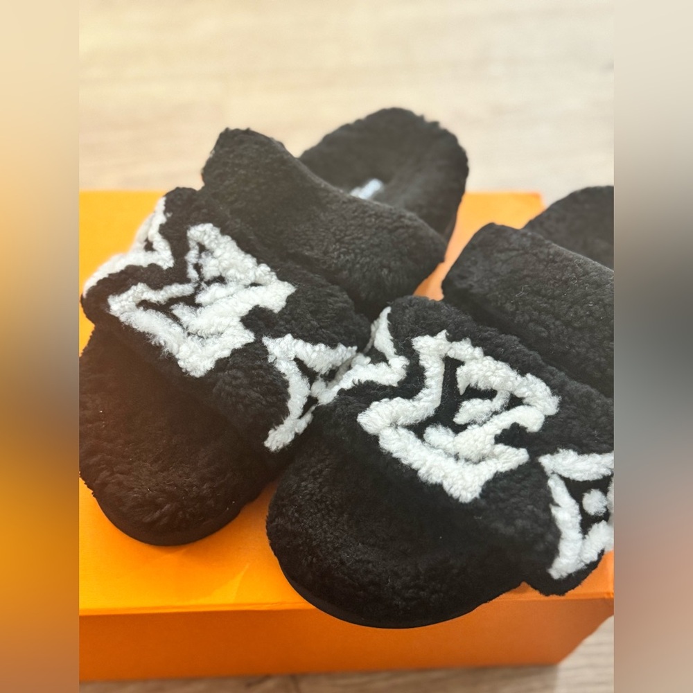 LV black and white teddy slip ons